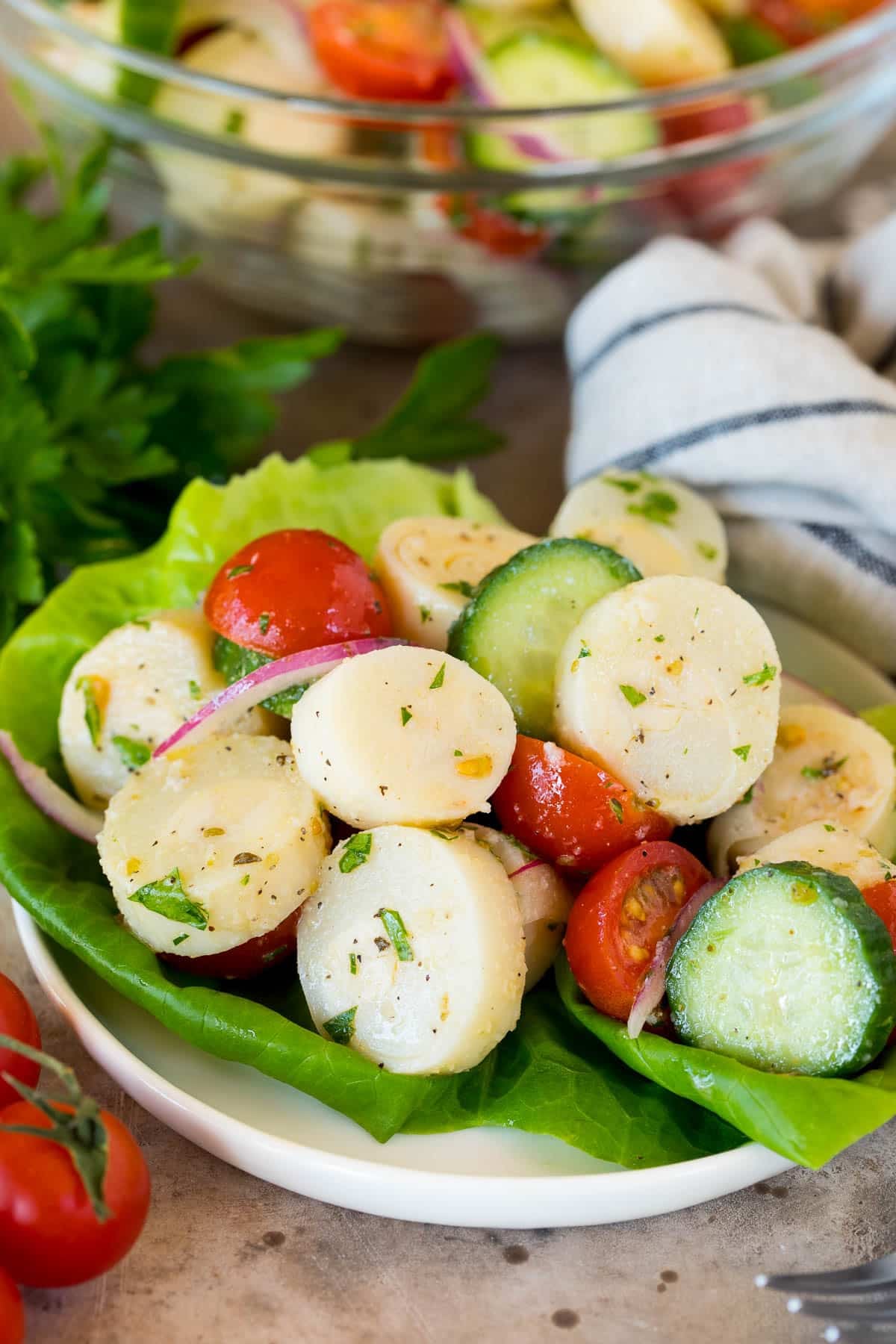 Hearts of palm salad served on a lettuce leaf.