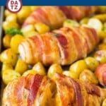 A tray of bacon wrapped stuffed chicken which is chicken stuffed with an incredible combination of three cheeses, garlic and herbs and wrapped with bacon.