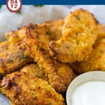 A basket of baked fried chicken which is crispy, crunchy, coated chicken hot out of the oven.