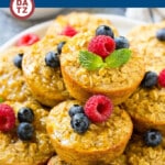 A plate of baked oatmeal cups which are a grab and go breakfast made with oats, milk, brown sugar and eggs.