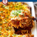 A dish of baked spaghetti which is pasta tossed in a flavorful meat sauce, then topped with plenty of cheese and baked until golden brown.