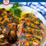 A plate of grilled chicken breast which is chicken soaked in a flavorful garlic and herb marinade, then grilled to perfection.