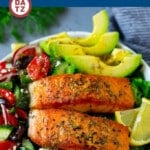 This Greek salmon salad is seared salmon fillets with cucumber, tomato, olives, red onion, avocado and feta cheese, all tossed in a garlic and herb dressing.