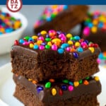 These Cosmic Brownies are cocoa brownies topped off with a rich chocolate fudge topping and rainbow sprinkles.