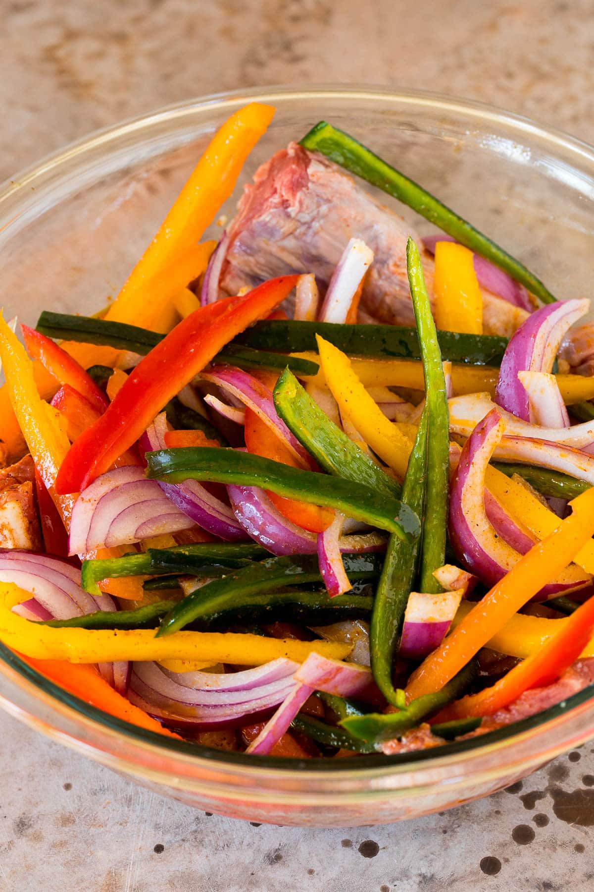 Steak, peppers and onions coated in marinade.