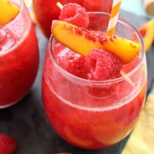 A picture of a frozen raspberry peach Bellini.