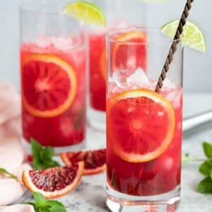 An image of three glasses with blood orange mojitos.