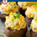 A group of crab stuffed mushrooms on a tray baked to golden brown perfection.