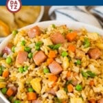 This ham fried rice is a savory blend of diced ham, scrambled egg, vegetables and rice, all stir fried together in a flavorful sauce.