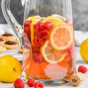 An image of a pitcher of rose sangria.