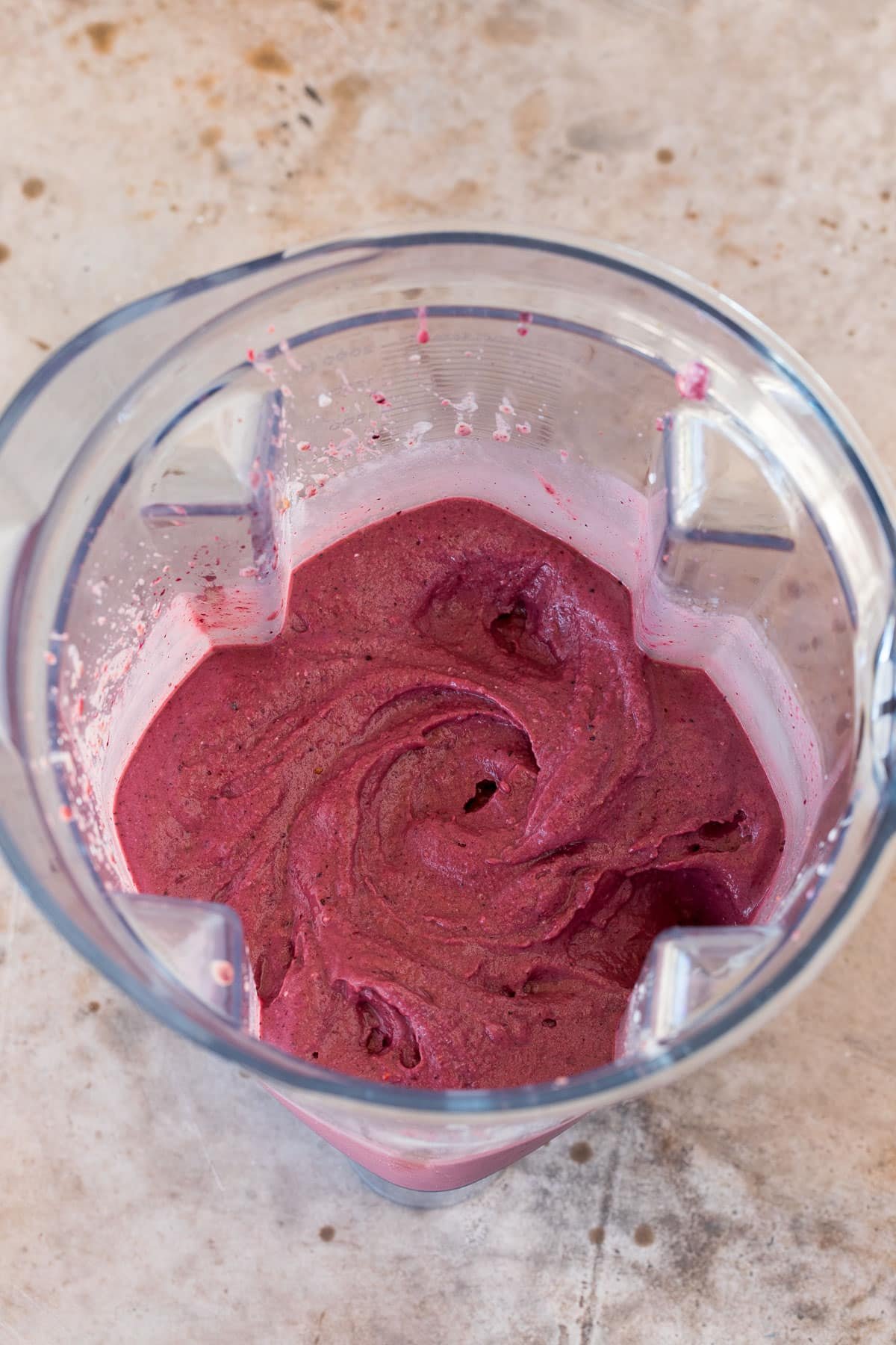 Pureed acai and fruit in a blender.