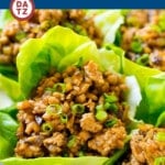 These chicken lettuce wraps contain ground chicken and veggies cooked in a savory sauce and served in cool lettuce leaves.