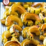 This delicata squash recipe is roasted with brown sugar, maple syrup and cinnamon for a sweet and savory side that's perfect for fall and winter meals.