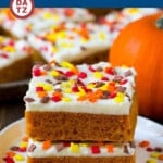 These pumpkin bars are light and fluffy cake bars made with pumpkin puree and spices, then topped with a layer of cream cheese frosting and sprinkles.