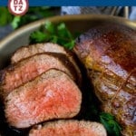 This beef tenderloin recipe is seared to golden brown perfection, then topped with flavorful garlic butter and roasted in the oven.