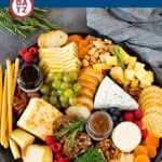 A guide to creating the best cheese board with a variety of different cheeses, crackers, fruit and accompaniments.