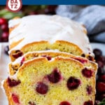 A loaf of cranberry bread with an orange glaze over the top.