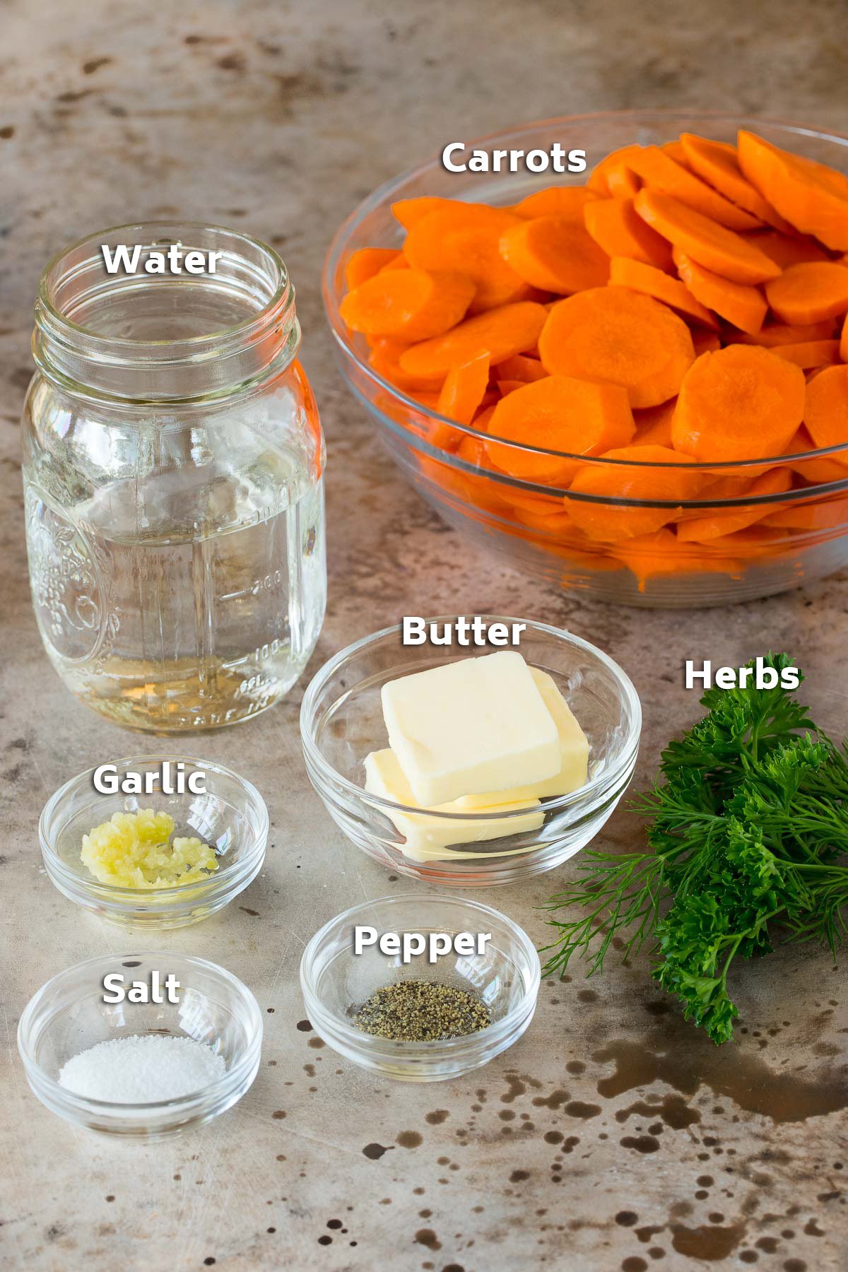 Bowls of ingredients including vegetables, butter and seasonings.