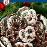 A bowl of chocolate covered pretzels with white chocolate and milk chocolate.