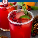 This Christmas margarita is a blend of tequila, orange, cranberry, lime and ginger, all mixed together to form the ultimate holiday cocktail.