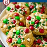 These monster cookies are the classic oatmeal peanut butter cookies all dressed up for Christmas with red and green M&M’s, white chocolate chips and holiday sprinkles.