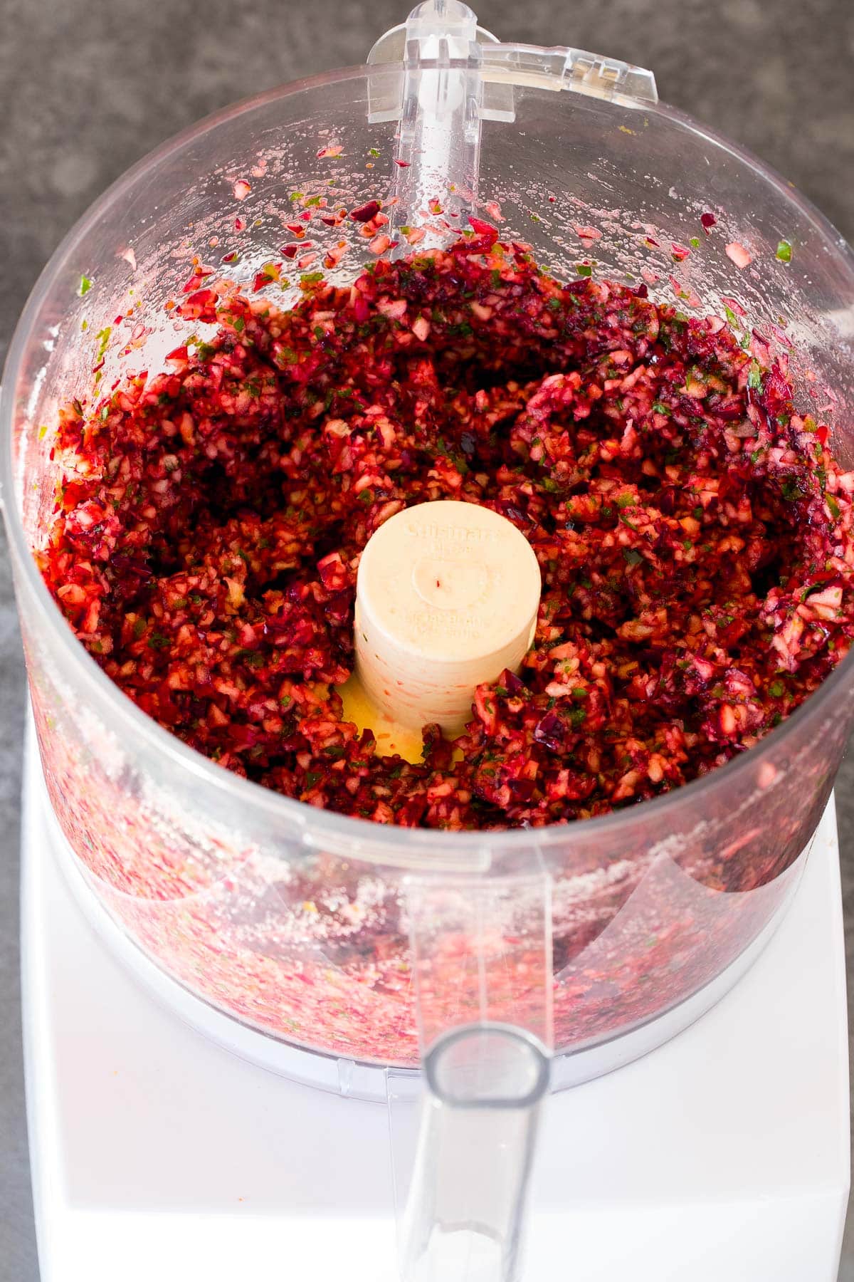 Cranberries, herbs and sugar ground together in a food processor.