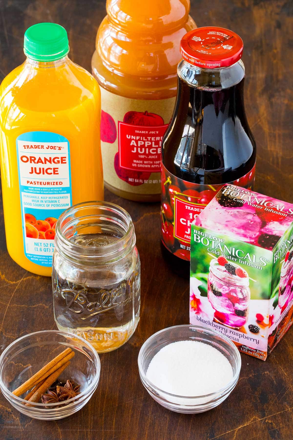 Bottles of juices, a box of tea bags, sugar and spices.