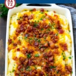This make ahead loaded mashed potato casserole is full of bacon, cheese, sour cream and chives. The perfect side dish for a holiday meal.