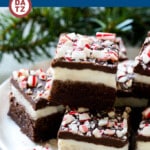A plate with a stack of peppermint brownies.
