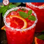 This blood orange margarita recipe is a combination of freshly squeezed orange juice, tequila, triple sec, lime juice and grenadine.