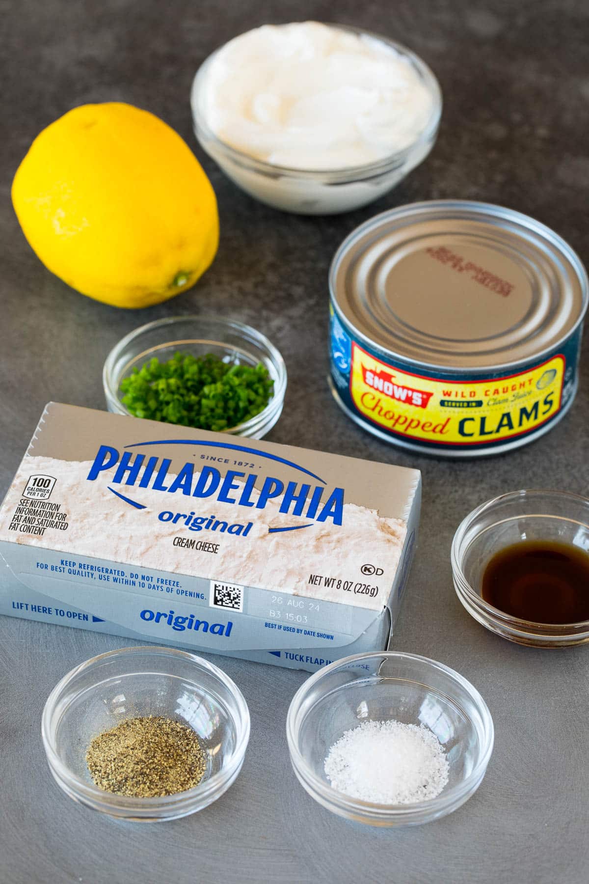 Ingredients including cream cheese, sour cream, canned clams and seasonings.