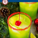 This Grinch cocktail is a green drink that gets its hue and flavor from Midori, vodka, fruit juices and lemon lime soda.