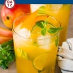 This mango mojito is a blend of fresh mint, lime juice, sugar, mango nectar and club soda.