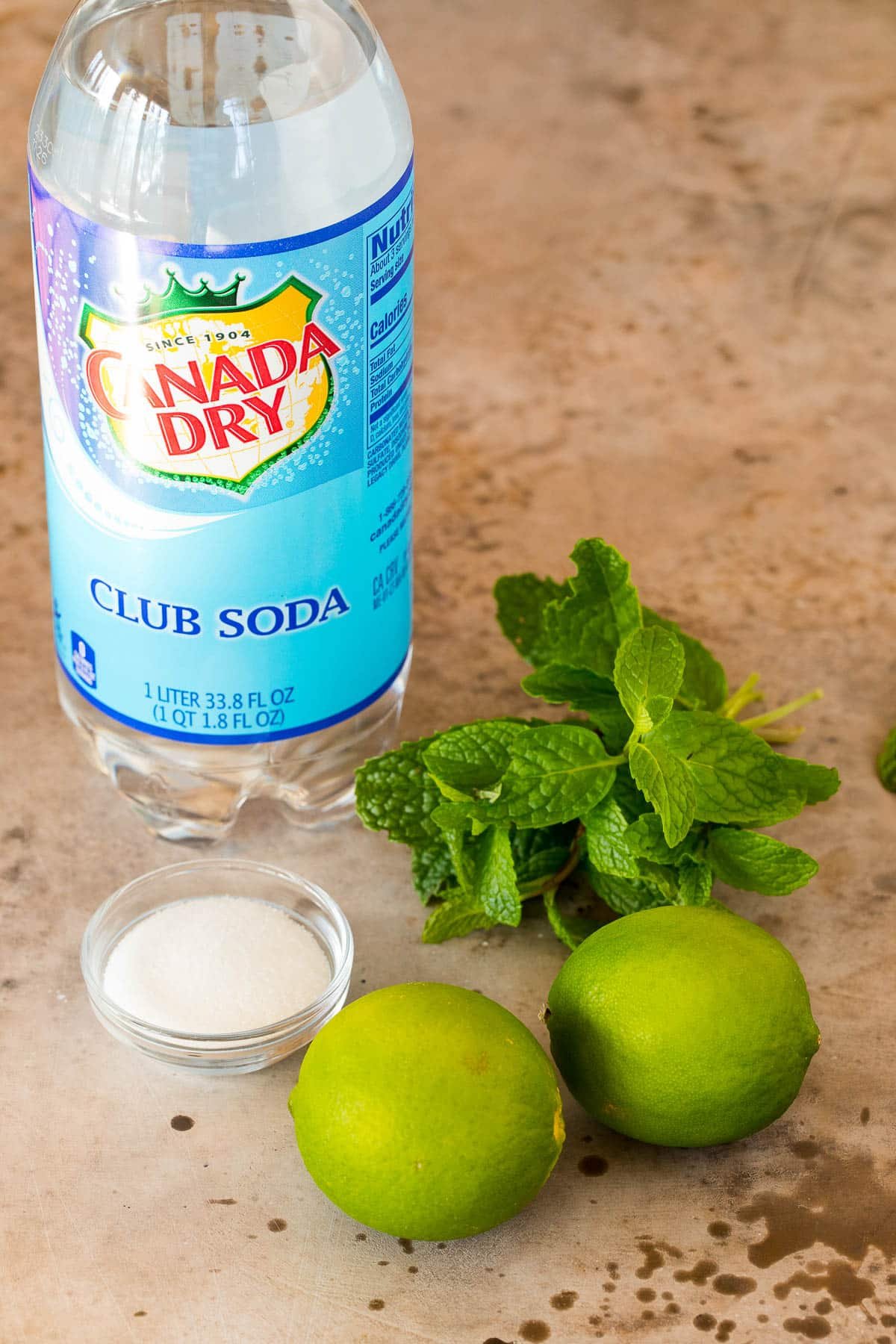 Club soda, sugar, a bunch of mint and two limes.