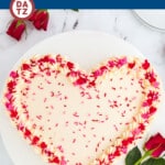 This heart cake recipe is a red velvet cake that is shaped like a heart, and topped with cream cheese frosting and sprinkles.