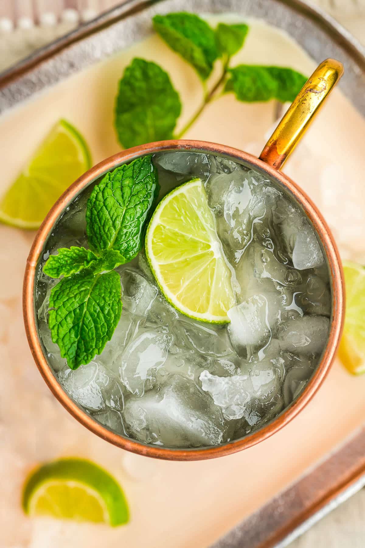An overhead view of an Irish mule with a copper mug filled with crushed ice and alcohol.