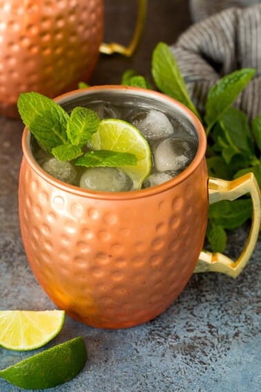 A Mexican mule in a copper mug topped with fresh mint and lime.