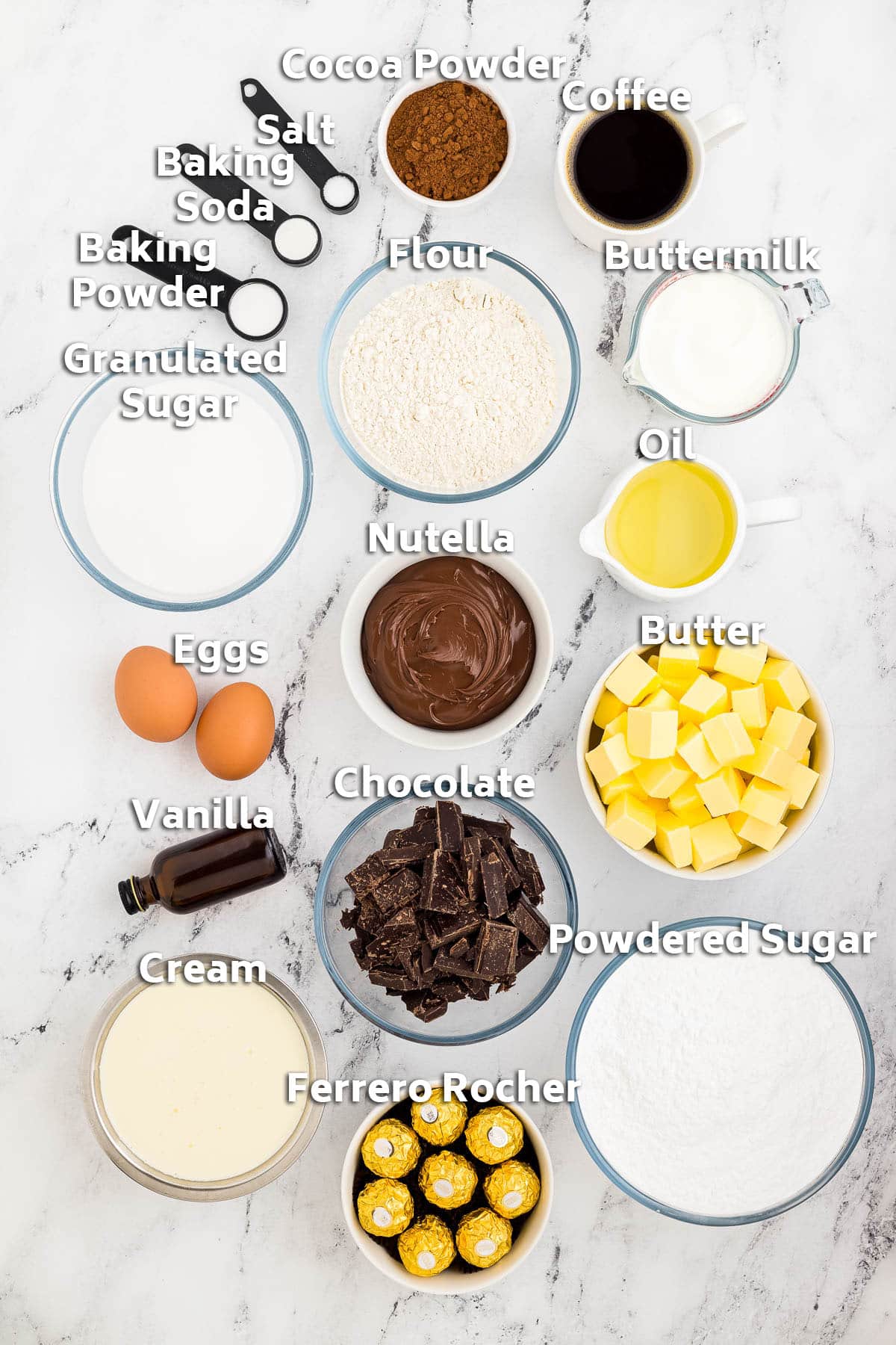 Bowls of ingredients including butter, flour, sugar, eggs and chocolate.