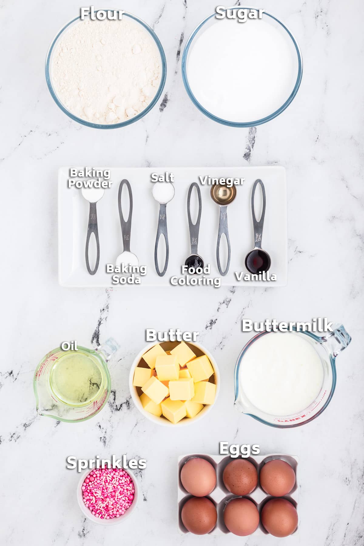 Bowls of ingredients including butter, oil, flour, sugar, eggs and sprinkles.