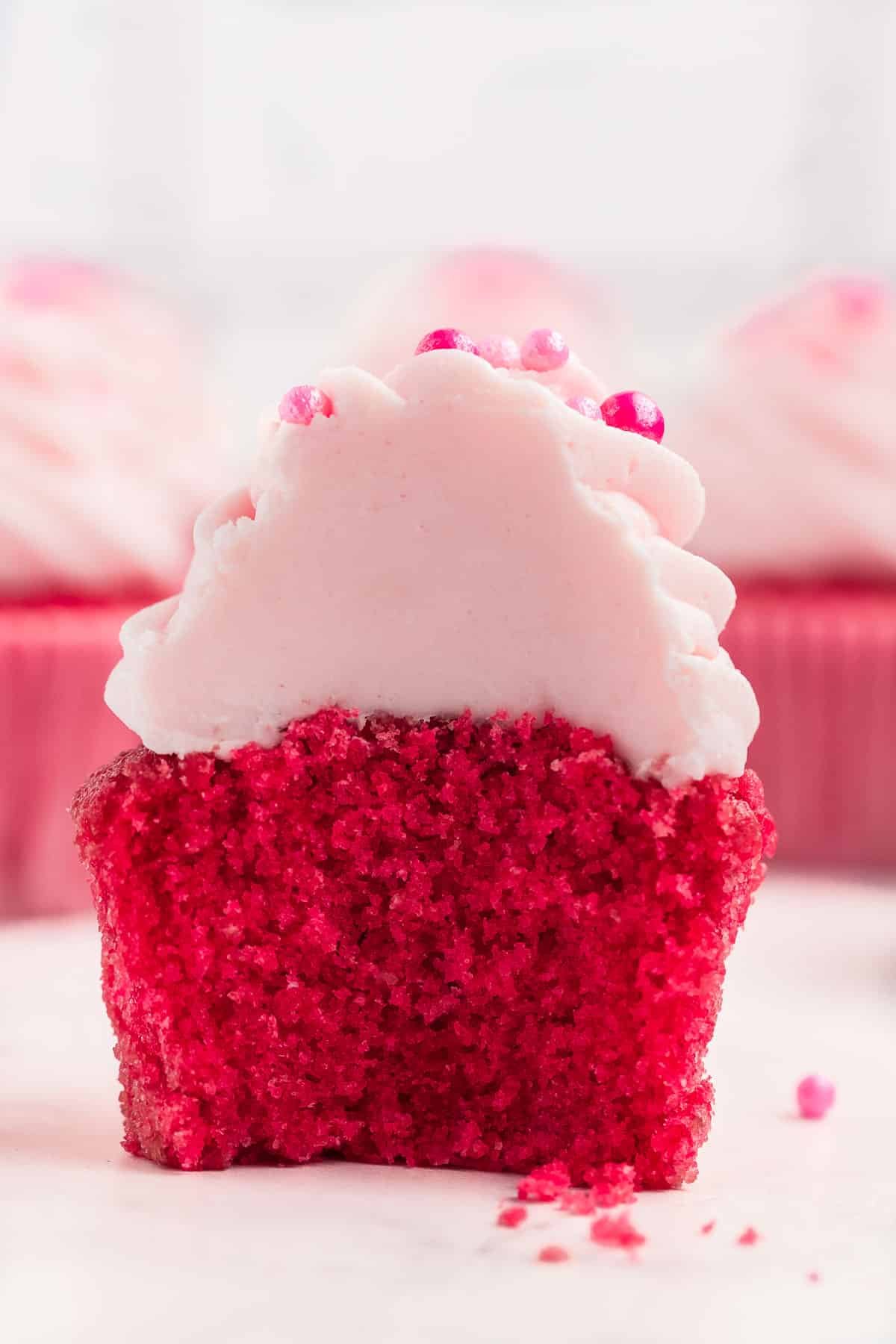 A pink cupcake cut in half.