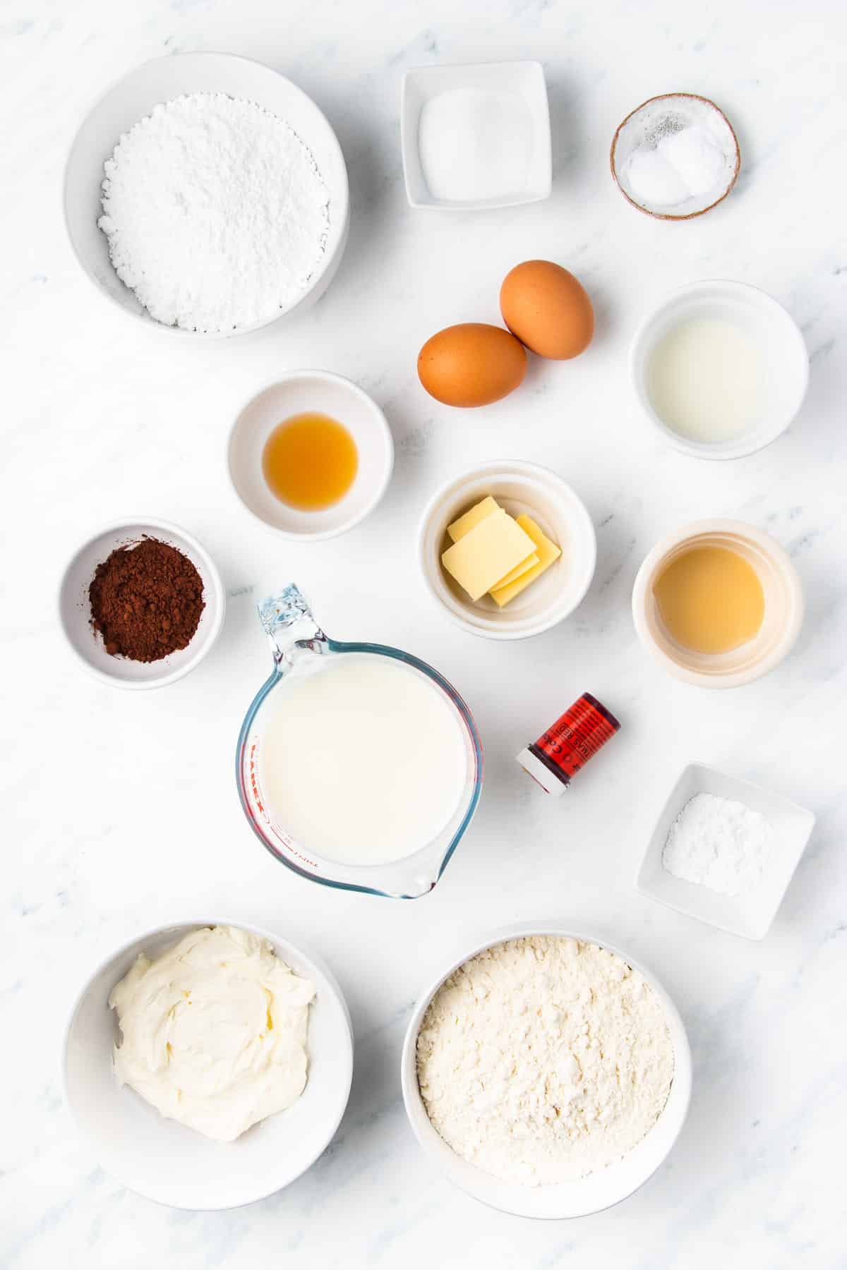 Bowls of ingredients including butter, sugar, buttermilk, cocoa powder and vanilla extract.