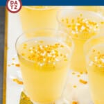 These champagne Jello shots are a mixture of champagne, vodka, lemon juice and sugar, served in shot cups with festive sprinkles on top.