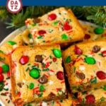 These Christmas cookie bars have a chewy brown sugar cookie base that's loaded with plenty of holiday M&M candies and sprinkles.
