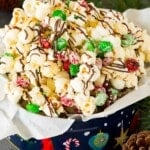 A gift tin filled with Christmas popcorn.