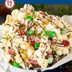 This Christmas popcorn is a sweet and savory blend of popcorn, white chocolate, dark chocolate, M&M's and holiday sprinkles.
