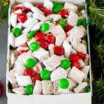 A holiday tin filled with Christmas puppy chow mix.
