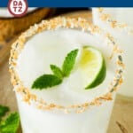 This coconut margarita is a blend of tequila blanco, triple sec, cream of coconut and lime juice, all mixed together to create a refreshing cocktail.