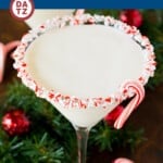 This peppermint martini is a refreshing blend of peppermint schnapps, creme de cacao, vanilla vodka and cream, all served up in a candy cane rimmed glass.