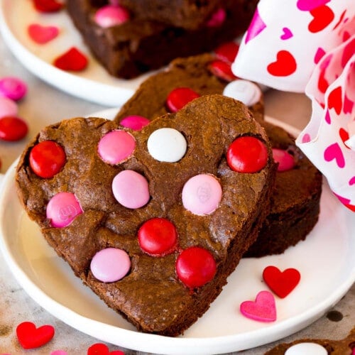 Valentine brownies on a plate, decorated with M&M's.