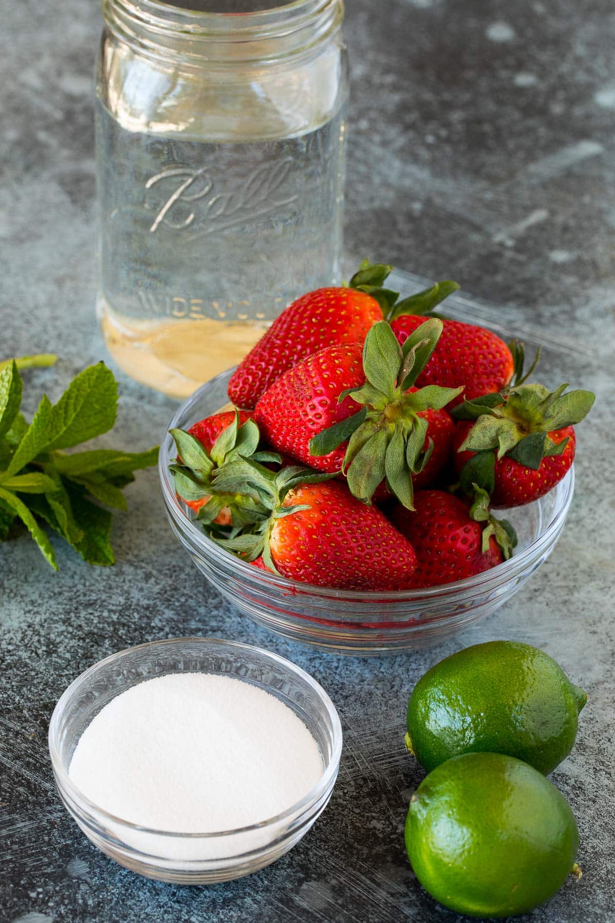 Strawberries, sugar, limes, water and mint.